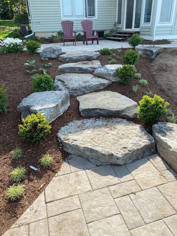 Flagstone steppers through planting beds