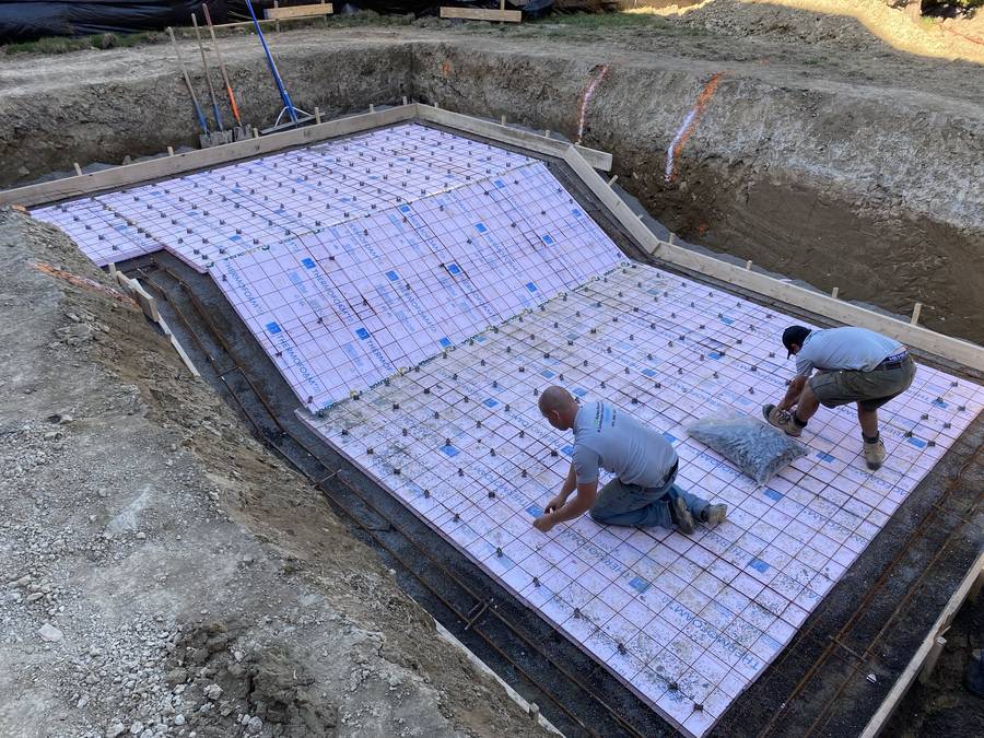 Reinforcing steel set over pool base insulation