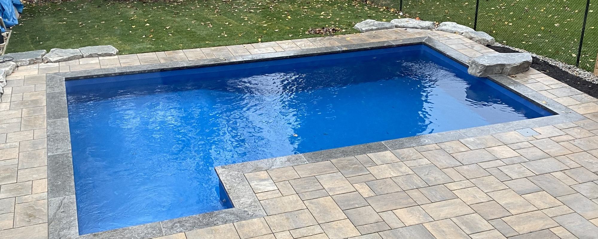 Finished pool with interlock surround