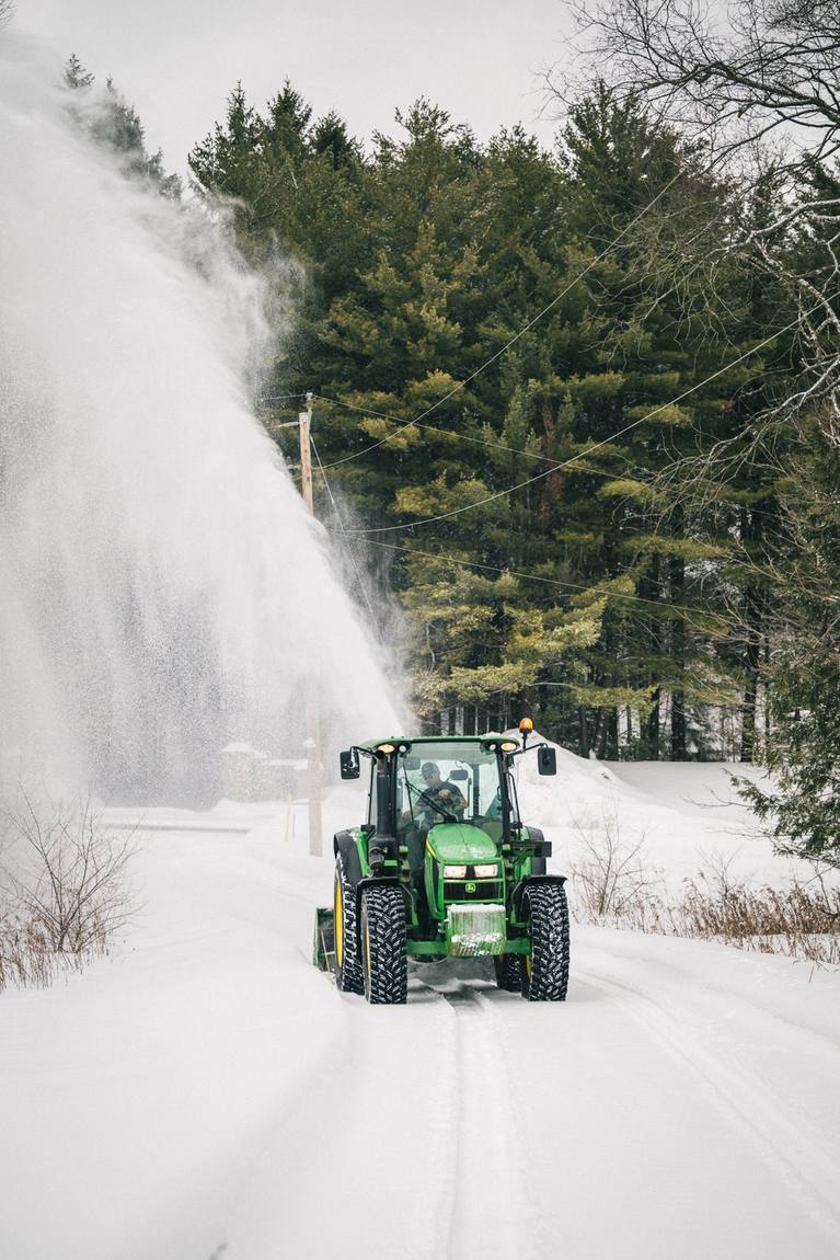 Snow blowing a rural lane