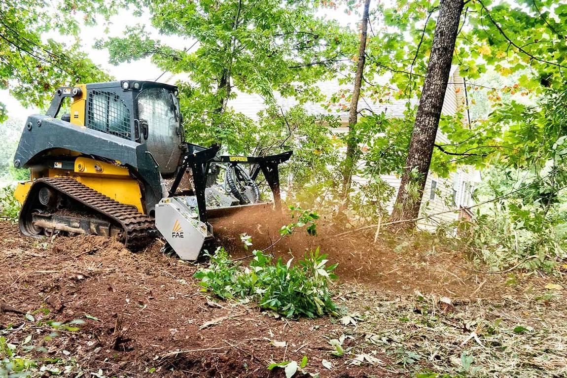 Land clearing with an excavator mounted mulcher